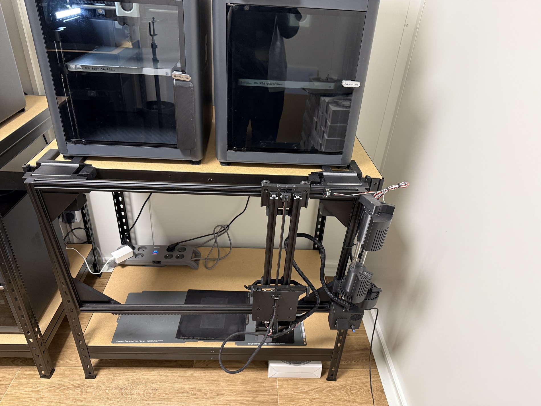 Real automatic build plate changer installed next to 3D printers